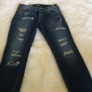 Dark, distressed, holy jeans